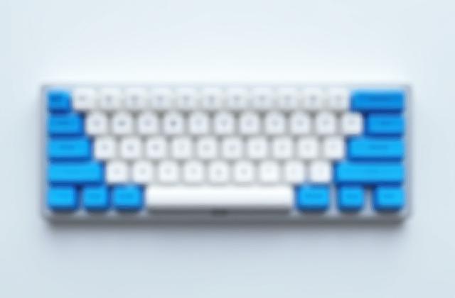 GMK Godspeed keycap set on a space-themed mechanical keyboard.